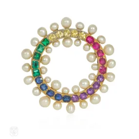 An Edwardian gem-set rainbow circle brooch